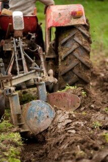 No-till gardening - tractor tilling the soil
