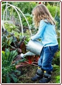 Kids garden crafts - girl watering vegetables
