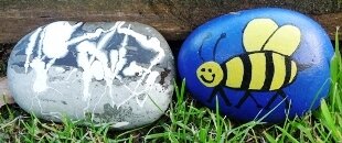 Kids Making things outside - painted stones in garden