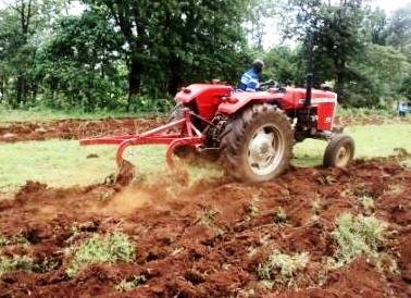 tractor tilling the soil